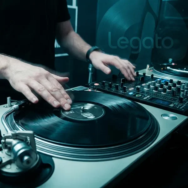 DJ hands mixing on vinyl turntable
